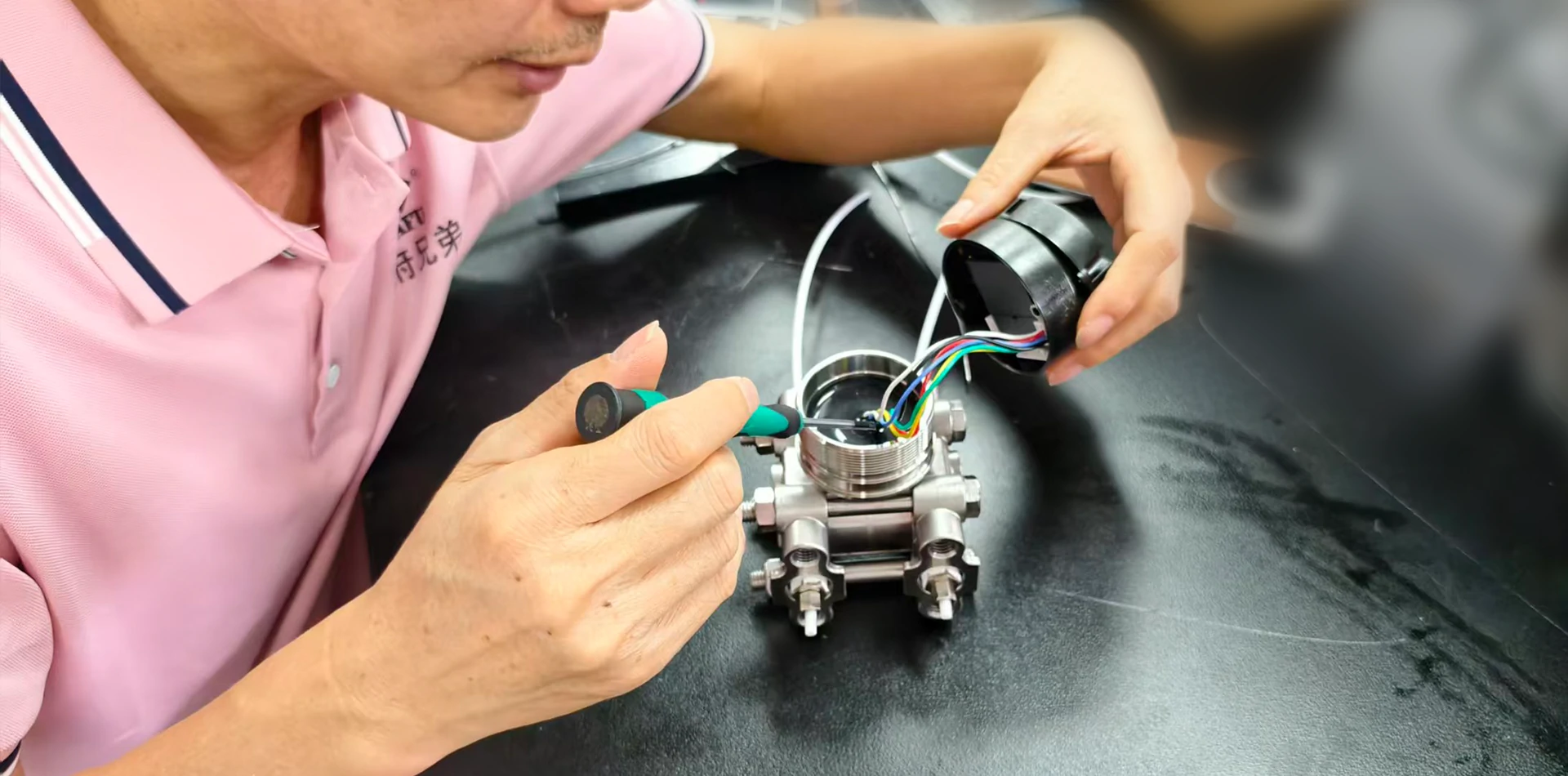 WAFU Brothers technician analyzing a custom sensor