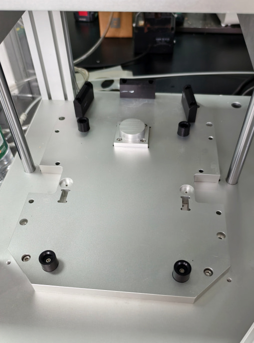 Lower fixture for the lawn mower housing