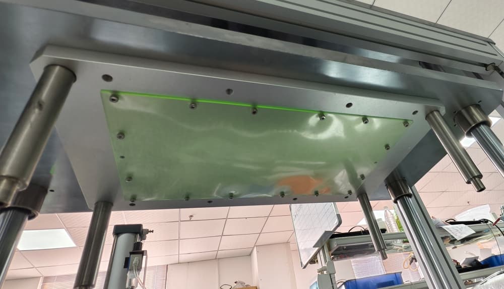 Upper fixture (pressing assembly) for wireless bridge enclosure leak tester